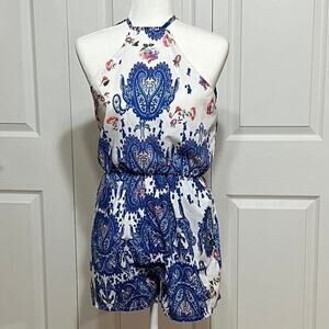 FuGui.xing sunsuit Size M short jumper. Floral design. Cold shoulder sleeveless